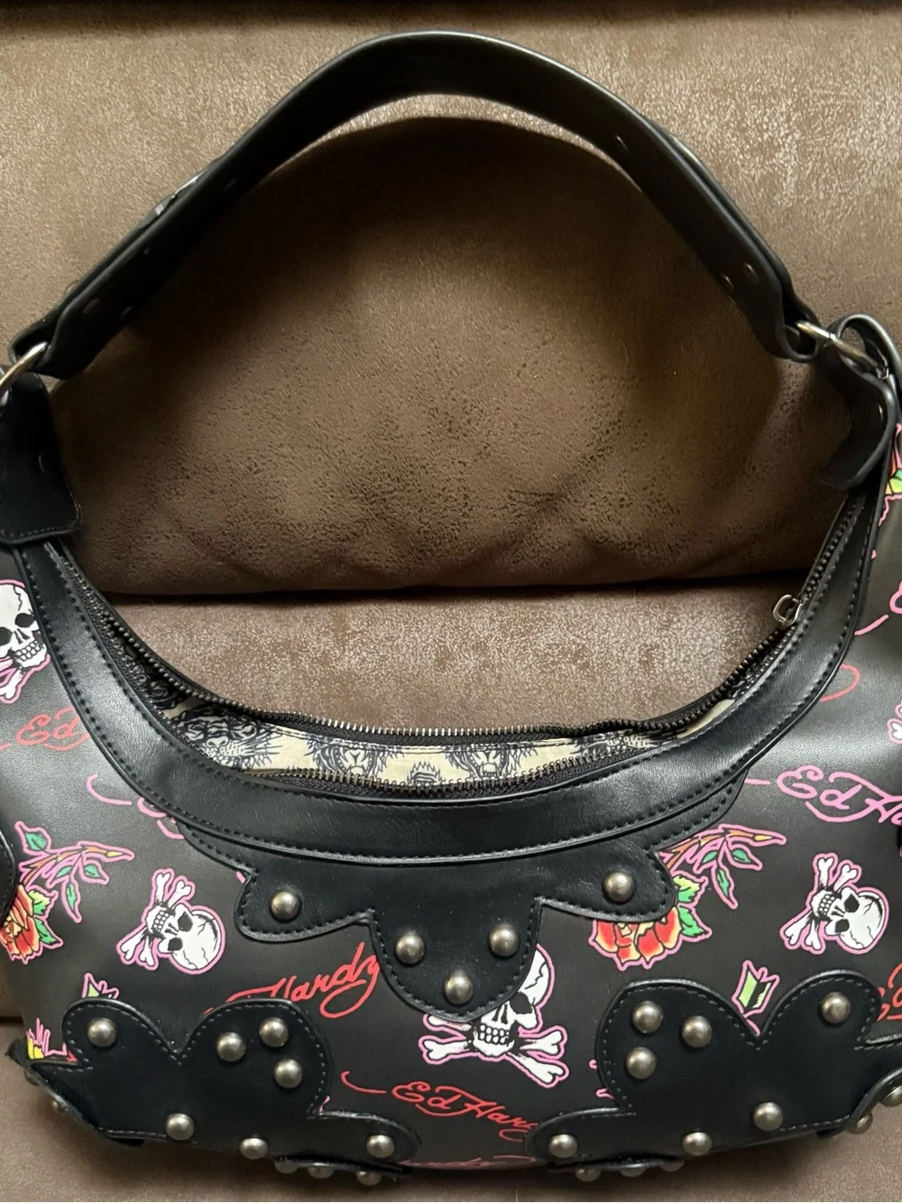 Signature Ed Hardy tattoo print Shoulder Bag with Skull, Rose & Pink accents.